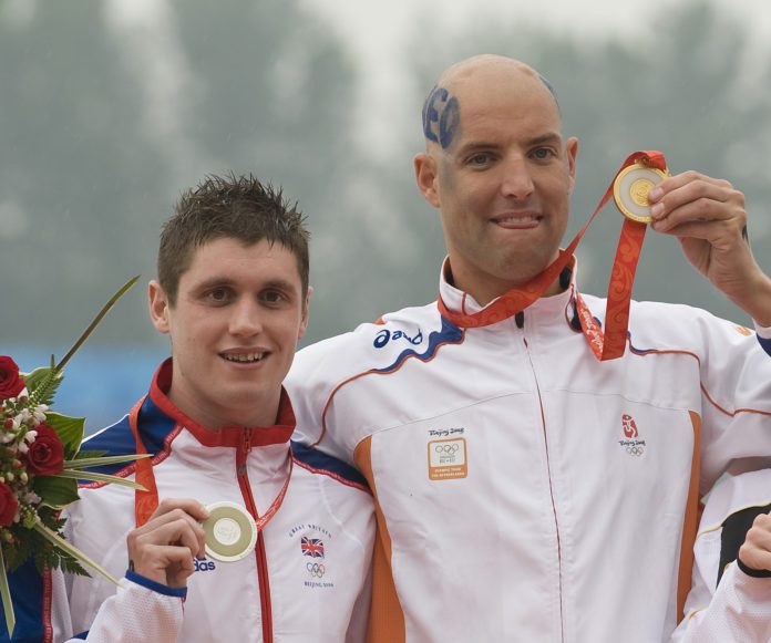 Gold Medallist Maarten Van Der Weijden Of The Netherlands (right) Alongside Great Britain's David Davies Who Took Silver On The Podium Following The Men's Marathon 10km Swimming Event Held At The National Aquatics Center During The 2008 Olympic Gam