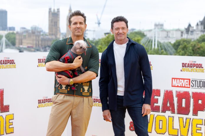 Peggy, aka, "Dogpool", Ryan Reynolds, and Hugh Jackman at the UK Photocall of Marvel Studios' "Deadpool & Wolverine" at IET London in July 2024
